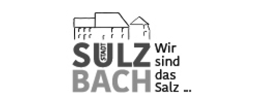 Logo von Sulzbach mit stilisierter Darstellung eines Gebäudes und der Aufschrift 